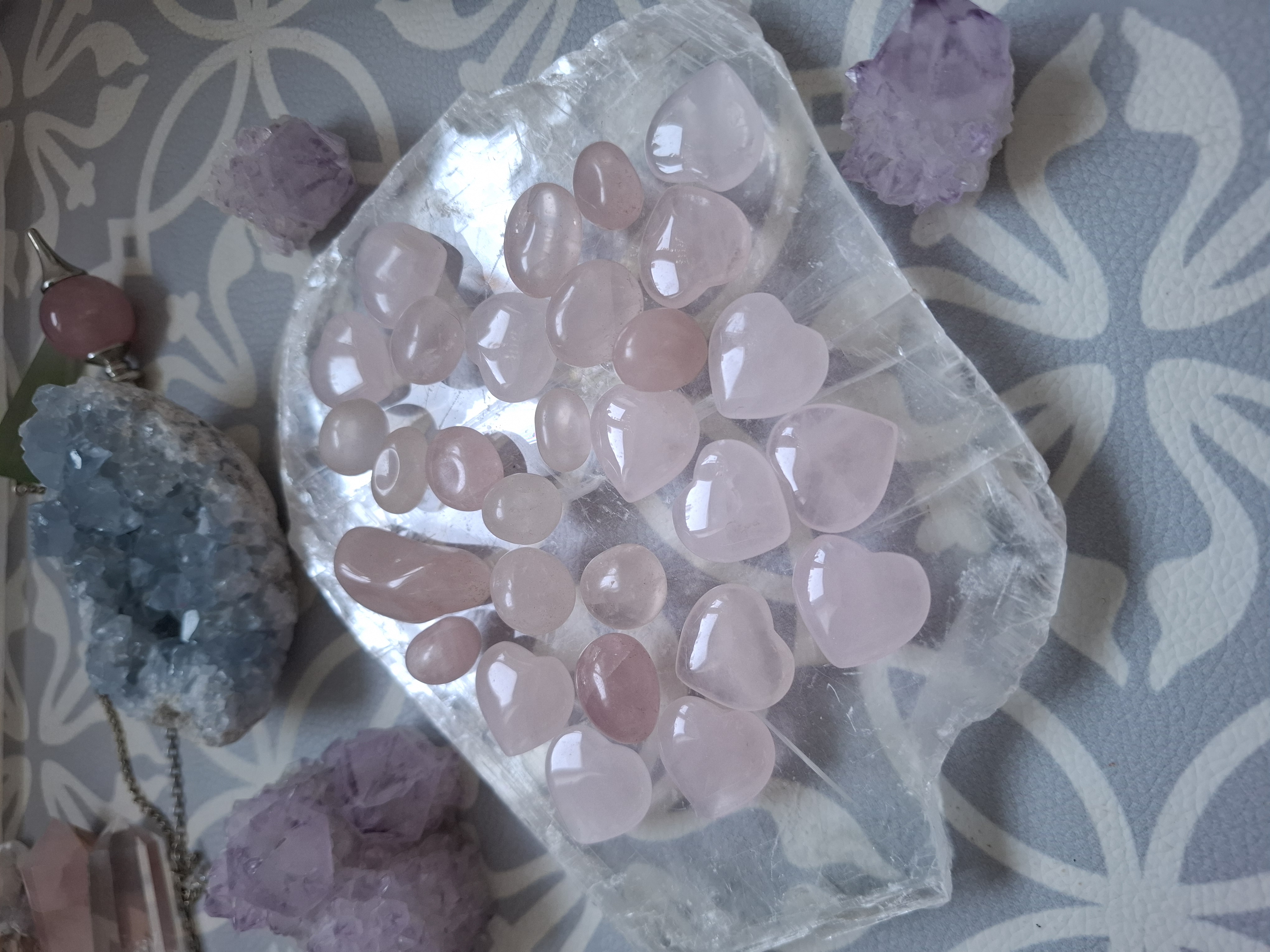 Rose quartz hearts on a selenite plate